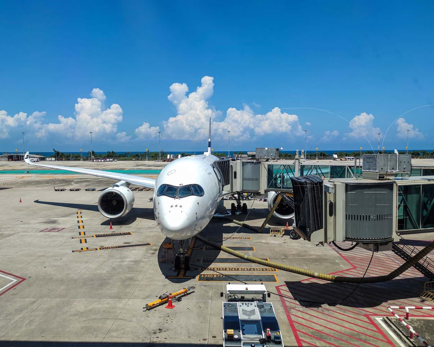 Jet plane at the gate at Phuket International Airport on a bright summer day