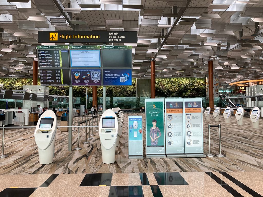 Self-service Thailand Digital Arrival Card kiosk in the arrivals area of a Thai airport
