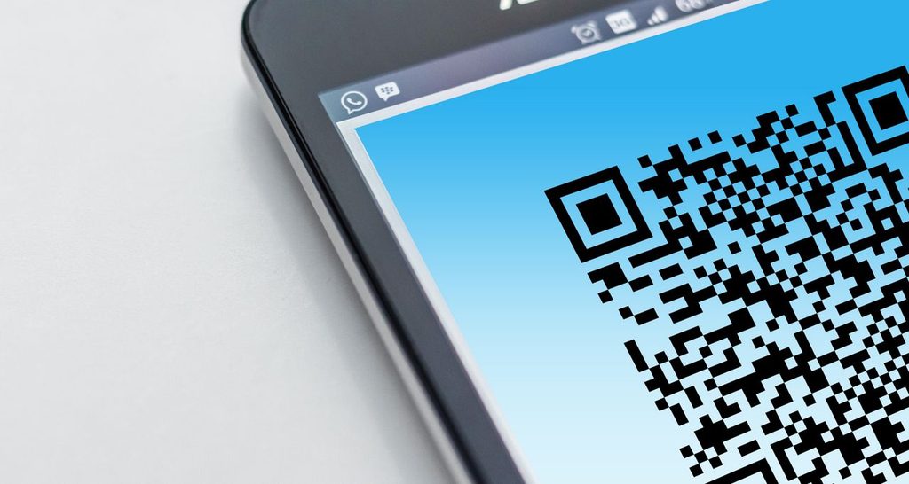 An eSIM QR code on a smartphone before a trip to Thailand